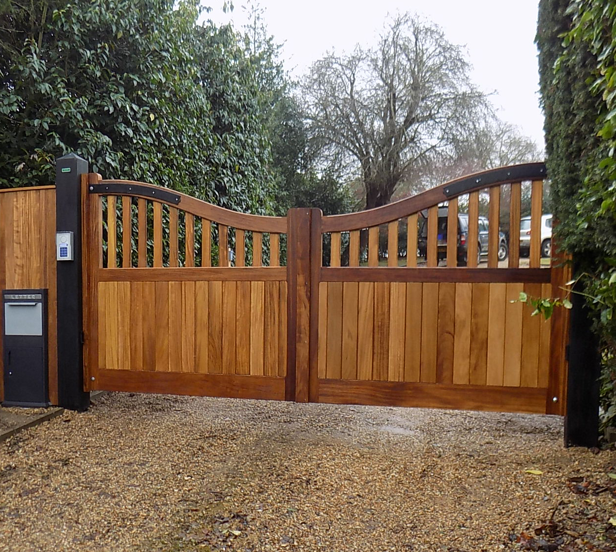 St Edmundsbury gates in oiled Iroko but with Douglas fir posts finished in black Barn paint